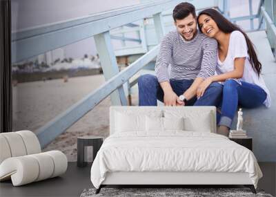 romantic couple spending intimate time together on life gaurd post in santa monica Wall mural