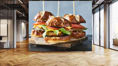 three vegan burger sliders with pretzel buns Wall mural