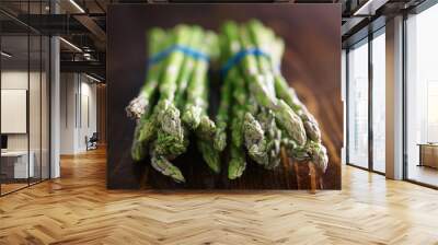 two bunches of asparagus on wooden table top Wall mural