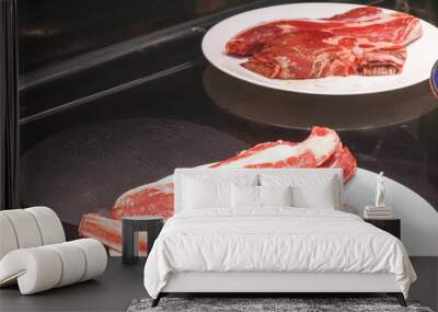 Veil steak being cooked in frying pan/ Wall mural