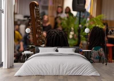 Duet of African musicians from Guinea Conakry play their traditional instruments, the kora and the pumpkin, in a show. Black mans with dreadlocks. Wall mural