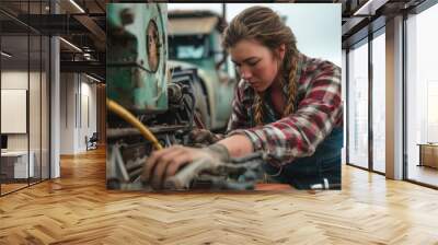 Woman fixing farm machinery Wall mural