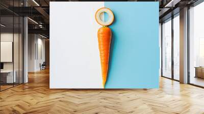 Carrot pastel blue white on paper two tone background. Minimal concept. Flat lay.  Wall mural