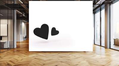 Two black hearts floating isolated on white background. Wall mural