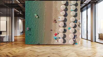 Aerial overhead view of lined beach umbrellas on a tropical beach Wall mural