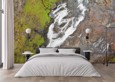 Aerial view of beautiful Stjornarfoss waterfall on a wet rainy day Wall mural