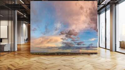 Amazing panoramic aerial view of sunset sky. Beautiful clouds and colors at dusk Wall mural