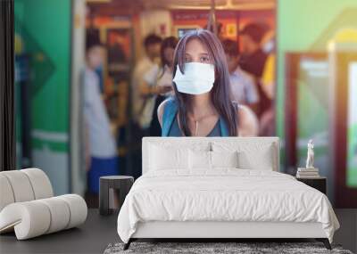 Asian girl wearing protective mask to avoid virus. Concept of Corona virus quarantine, Covid-19 outbreak Wall mural