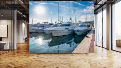 Sanremo, Italy - December 30, 2023: Yachts along the port of Sanremo on a beautiful afternoon Wall mural