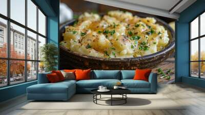 Showcase the creamy smoothness of a bowl of creamy mashed potatoes, featuring buttery flavor and a sprinkle of fresh herbs. Wall mural