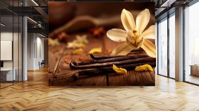 Dried vanilla sticks and vanilla orchid on wooden table. Close-up. Wall mural