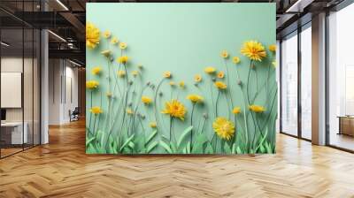 Green grass and yellow flowers on light green background minimal top view flat lay with top copy space Wall mural