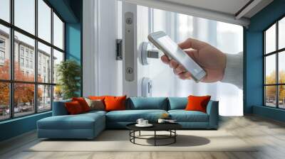 Hand using smartphone for close digital door lock at home or apartment. NFC Technology, Fingerprint scan, keycard, PIN number, smartphone, electrical and contactless lifestyle concepts Wall mural