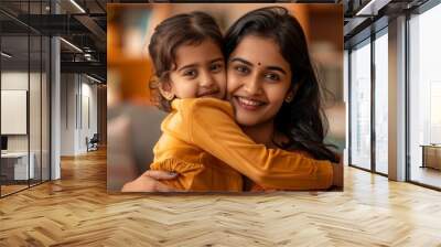 Moment of child hugging and embracing mom. Portrait of happy Indian American mommy and her child kid Wall mural