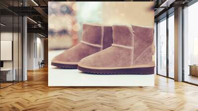 Pair of  trendy leather women boots on the shelf at the shoe store Wall mural