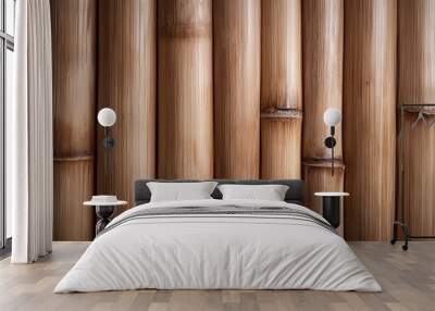 Rustic brown bamboo poles create an intricate, earthy texture in a close-up shot, highlighting the natural wood grain and cultural craftsmanship significance. Wall mural