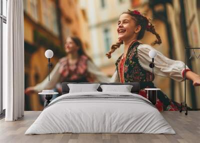 A beautiful girl in traditional Czech clothing in street with historic buildings in the city of Prague, Czech Republic in Europe. Wall mural