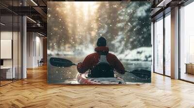 A man kayaking in lake water in winter with snow Wall mural