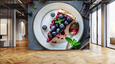 A slice of cheesecake with blueberry fruit in plate on table Wall mural