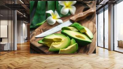 Fresh avocado fruit on wooden cutting board Wall mural