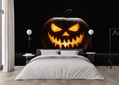 Halloween holiday carved pumpkin with black background Wall mural