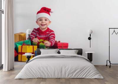 Happy child with gift box in holiday season. Wall mural