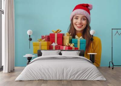 Happy female with gift box in holiday season. Wall mural