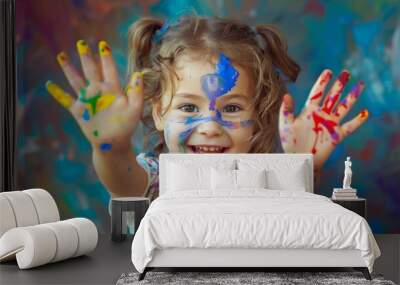 Happy little girl playing with paint Wall mural