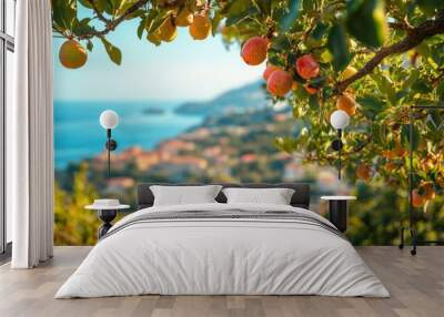 Pear tree with ripe fruit and buildings of a coastal village Wall mural