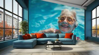 Portrait of a smiling female swimmer in water in pool Wall mural