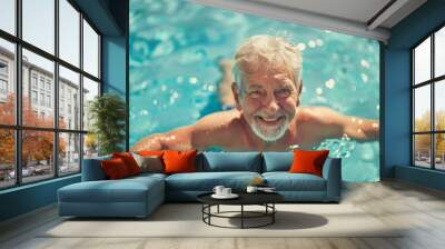 Portrait of a smiling senior male in water in pool Wall mural