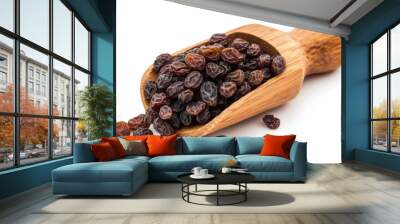 Raisin grain in wooden scoop spoon closeup view Wall mural