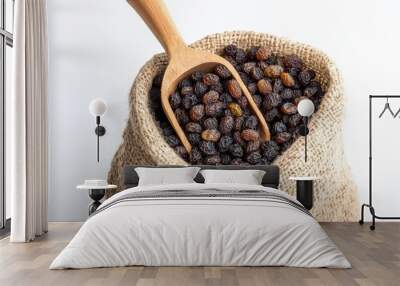 Raisin grain in wooden spoon closeup view Wall mural