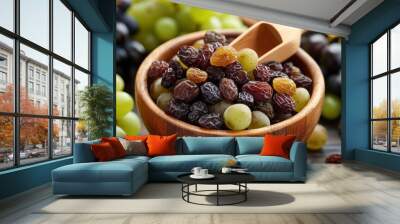 Raisin grain in wooden spoon closeup view Wall mural