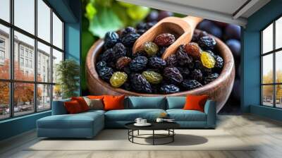 Raisin grain in wooden spoon closeup view Wall mural