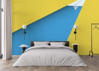 paper plane on yellow background as a symbol of leadership and creativity. Wall mural