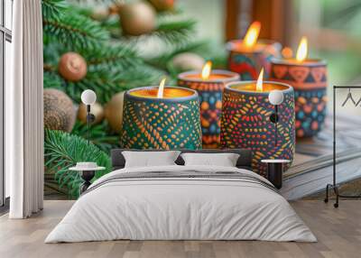 Burning kinara candles celebrating kwanzaa with christmas tree in background Wall mural