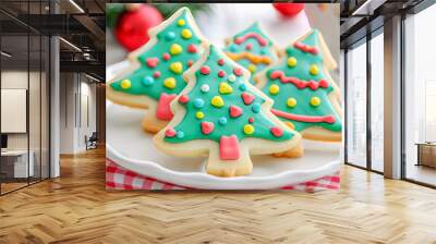 Christmas tree shaped sugar cookies decorated with colorful icing for holiday celebration Wall mural