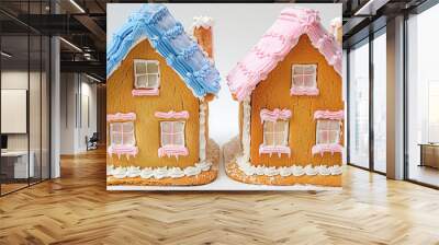 Two gingerbread houses with blue and pink frosting celebrating gingerbread house day Wall mural