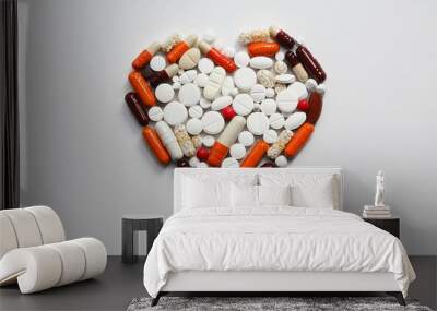 Artistic heart made from a variety of medicine tablets, emphasizing the importance of health Wall mural