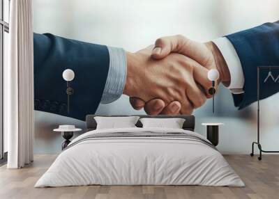 Close-up of two businesspeople shaking hands with documents being exchanged in the background, business trust, sealed deal Wall mural