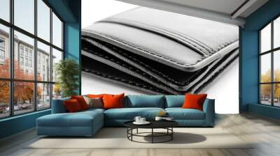 Stylish black leather wallet with detailed stitching, opened to reveal multiple compartments, isolated on white Wall mural