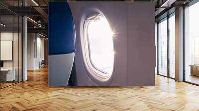 The light of the sun at the airplane window Wall mural