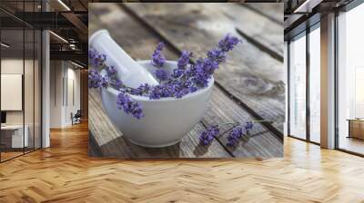 white ceramic mortar and pestle with fresh lavender on a old wooden background Wall mural