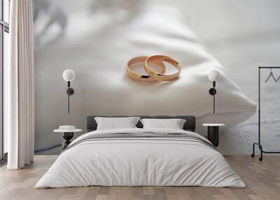 Two wedding rings with white flower in the background, wedding p Wall mural