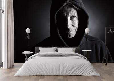 Low Key Shot of an Intimidating Senior Male in Hooded Top Wall mural