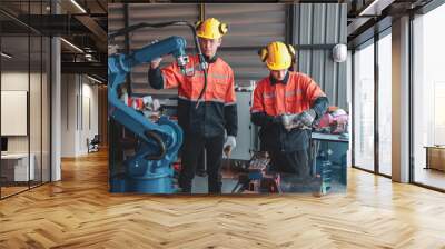 Industrial Team Working on Robotic Arm Maintenance Wall mural