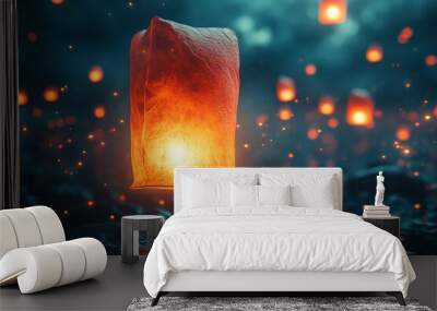 A lit flying candle over water Wall mural