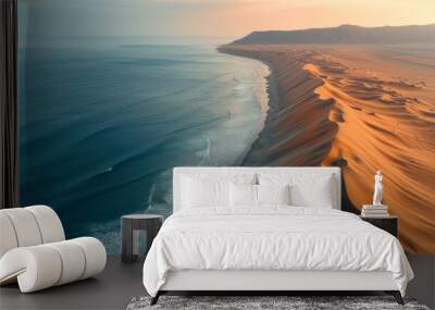 Sand dunes in a desert, right by the sea Wall mural