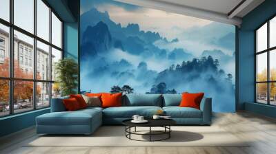 The mountains are covered in fog and the sky is blue Wall mural